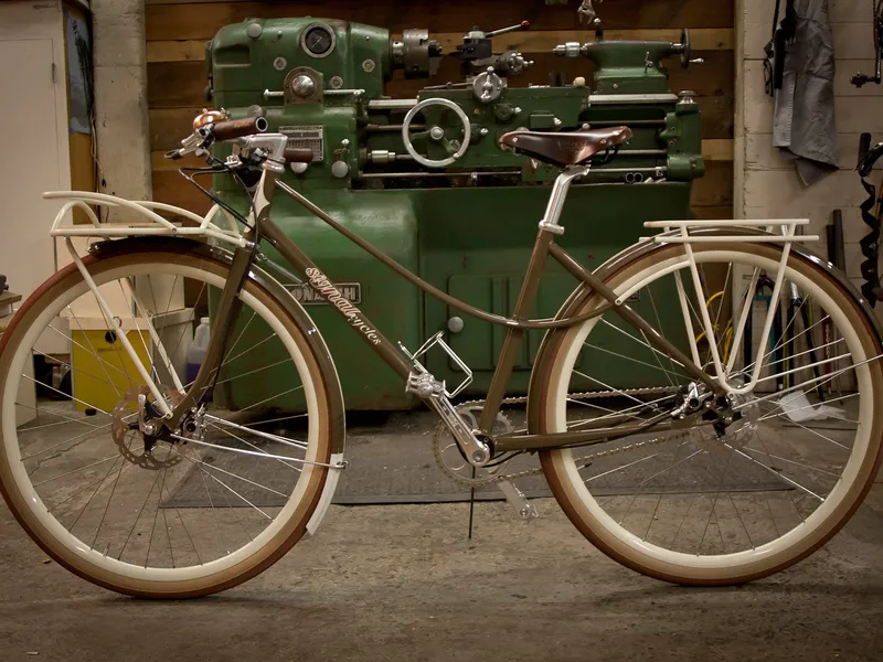 The finished 650b mixte, full profile in the shop